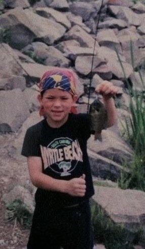 Young John Malecki fishing as a kid
